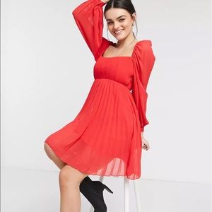 Flirty red pleated mini dress